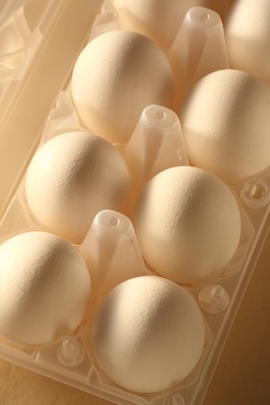 Raw eggs in the white packageの写真素材