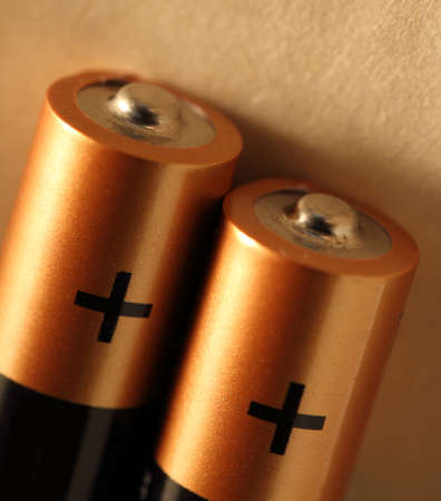 Two batteries with plus sign visibleの写真素材