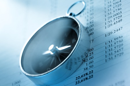 Operating budget and black compass in toningの写真素材