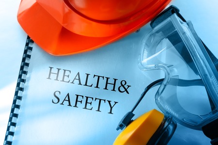 Safety goggles, earphones and red helmetの写真素材