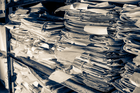 Paper documents stacked in archiveの写真素材
