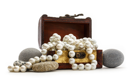 Wooden chest with white pearl necklace and sea stonesの写真素材
