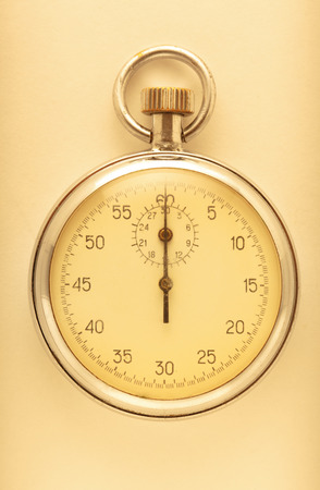 Stopwatch closeup on the light beige backgroundの写真素材