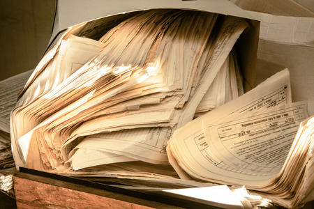 Dirty messy paper documents as background closeupの写真素材