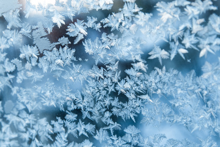 Shiny winter window ice snowflakes decoration closeupの写真素材