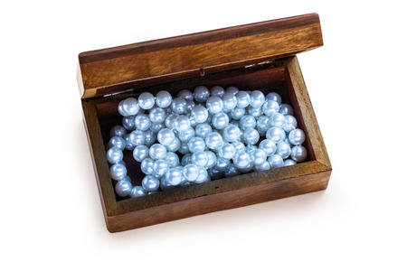 Small wooden chest with white pearl necklaceの写真素材