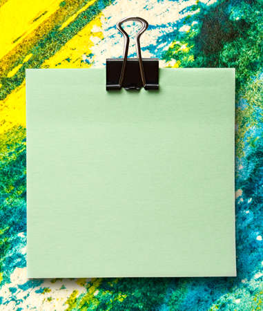 Blank green sticker and black clip surfaceの写真素材