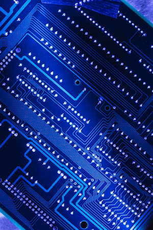 Computer board closeup in blue light toning