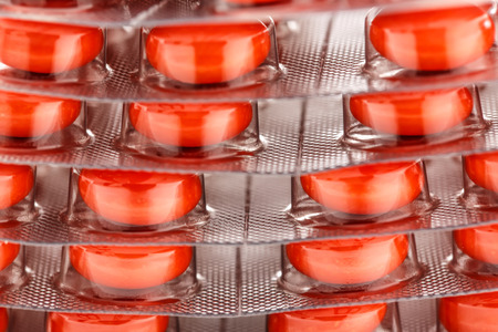Colourful tablets in plastic packing as backgroundの写真素材