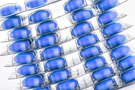 Colourful tablets in plastic packing as backgroundの写真素材