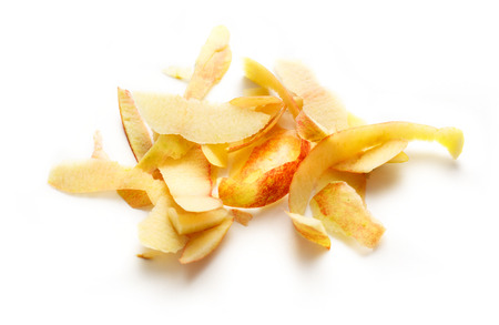 Yellow apple peelings on the white backgroundの写真素材