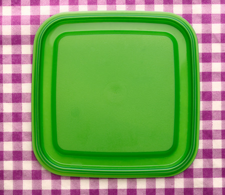 Green square plastic cover on background closeupの写真素材