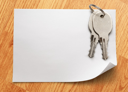 Blank sheet of paper with iron keysの写真素材