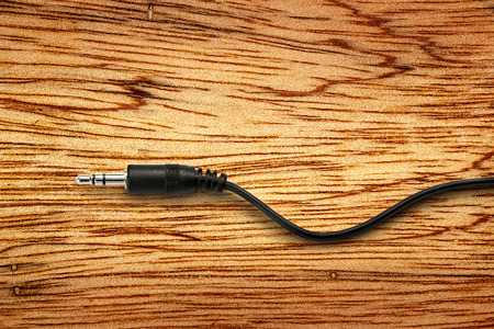 Black jack plug on the wooden backgroundの写真素材