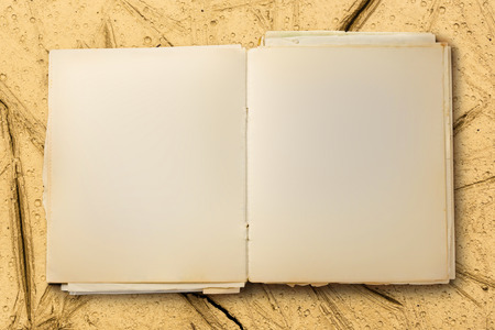 Old blank notebook open on colorful backgroundの写真素材
