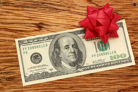 Dollar banknote with decorative bow in closeupの写真素材