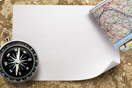 Compass with map on blank piece of paperの写真素材