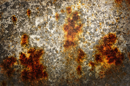 Rusty piece of metal as background in closeup