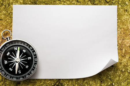 Compass on blank white piece of paperの写真素材