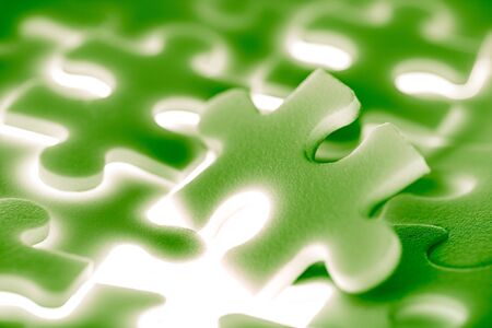 Background of large shining puzzles in greenの写真素材