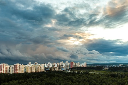 Sunset over city buildings view from aboveの写真素材