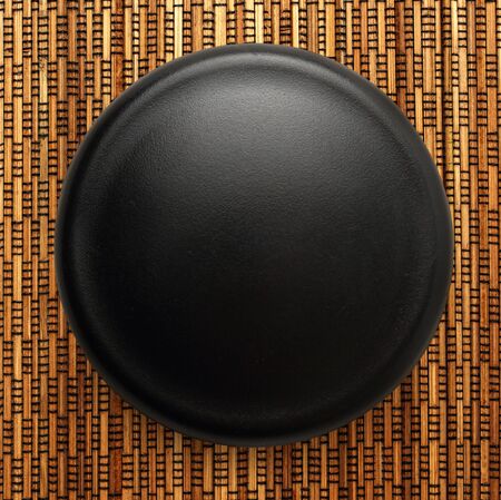 Blank black button as background in closeupの写真素材