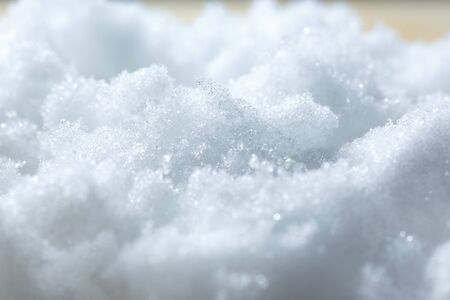 Fresh white snow textured background in closeup