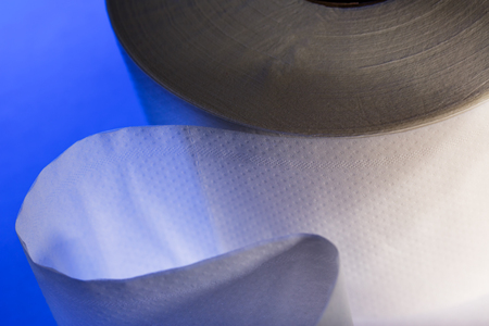 One white toilet paper roll in closeupの写真素材