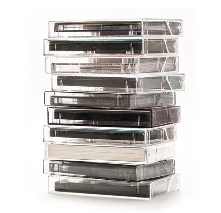 Stack of old cassettes on white backgroundの写真素材