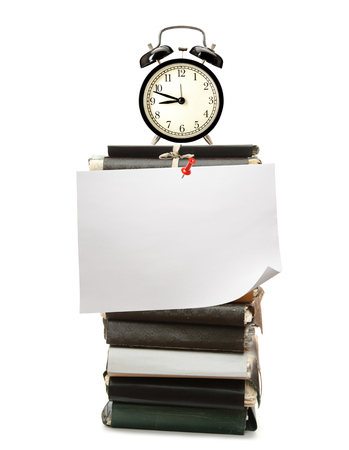 Old folders, alarm clock and blank paperの写真素材