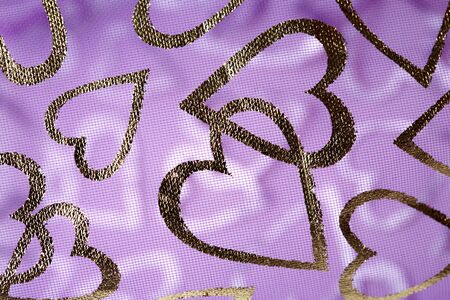 Romantic textile background with hearts in closeup