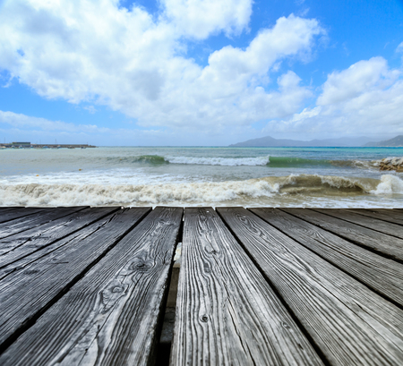 Wooden rostrum on sea view and sky backgroundの写真素材