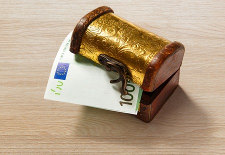 Treasure chest with one hundred euro banknoteの写真素材