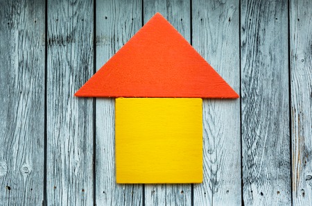 Little wooden house made of toy blocksの写真素材