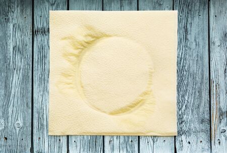 Dirty napkin in closeup on wooden backgroundの写真素材
