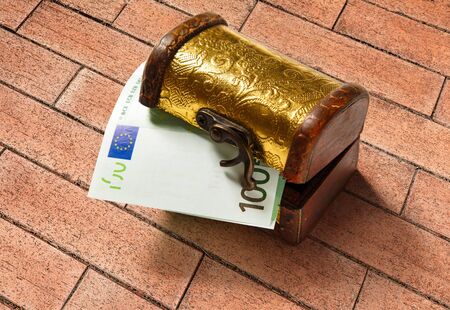 Treasure chest with one hundred euro banknoteの写真素材