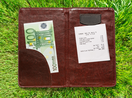 Open check folder with bill and euro banknotesの写真素材