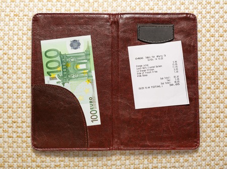 Open check folder with bill and euro banknotesの写真素材