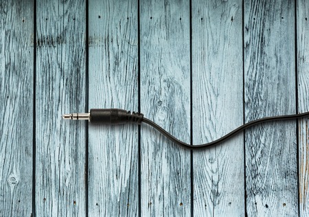 Jackplug on the wooden background in closeup