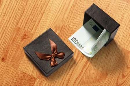 Gift box with one hundred euro banknotesの写真素材