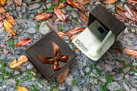 Gift box with one hundred euro banknotesの写真素材