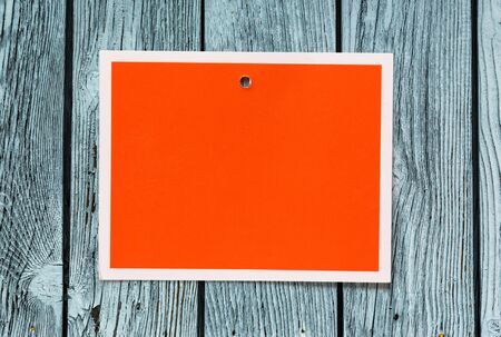 Blank red card on the wooden backgroundの写真素材
