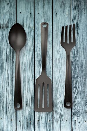 Kitchen utensil collection on wooden backgroundの写真素材