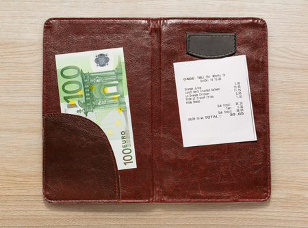 Open check folder with bill and euro banknotesの写真素材