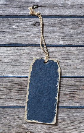 Blue blank paper label on wooden backgroundの写真素材