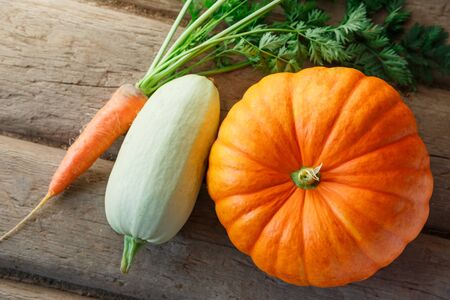 Fresh vegetables on wooden background in closeupの写真素材