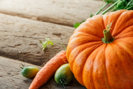 Fresh vegetables on wooden background in closeupの写真素材