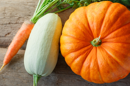 Fresh vegetables on wooden background in closeupの写真素材