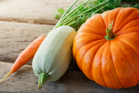 Fresh vegetables on wooden background in closeupの写真素材