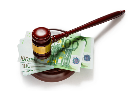 Wooden judge's gavel and one hundred euro banknotesの写真素材